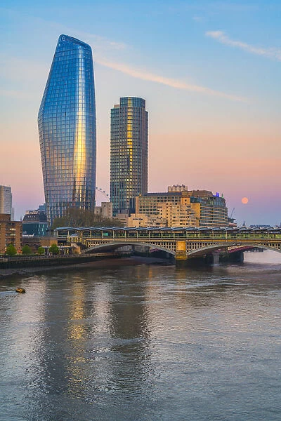 One Blackfriars and South Bank Tower mirrored in River Thames, London, United Kingdom