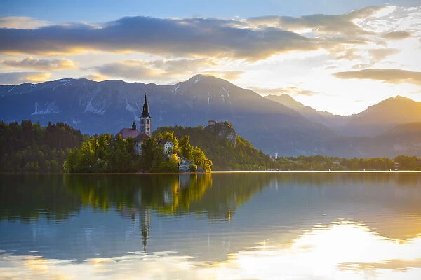 Bled Island with the Church of the Assumption illuminated at sunrise, Lake Bled, Bled