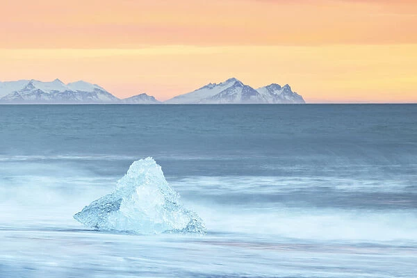 a block of ice at Diamond Beach taken during a winter sunset, Jokusarlon Glacier Lagoon, Austurland, Iceland