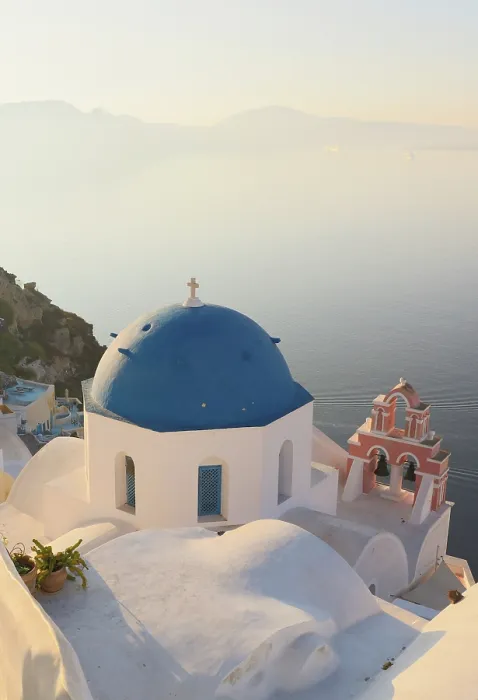 Framed Print : Blue domed churches, white-washed houses and steps with caldera view in the distance, Oia, Santorini, Cyclades Islands, Greece Framed Print : Blue domed churches, white-washed houses and steps with caldera view in the distance, Oia, Santorini, Cyclades Islands, Greece