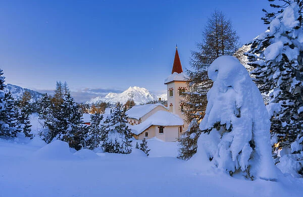 Blue hour at Chiesa Bianca surrounded by snow, Maloja, Bregaglia Valley