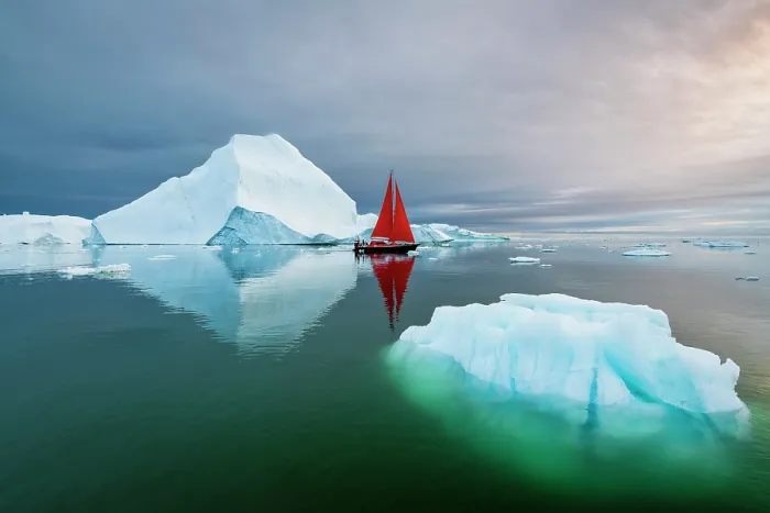Framed Print : Blue iceberg and red sailboat in Disko Bay, Greenland Framed Print : Blue iceberg and red sailboat in Disko Bay, Greenland