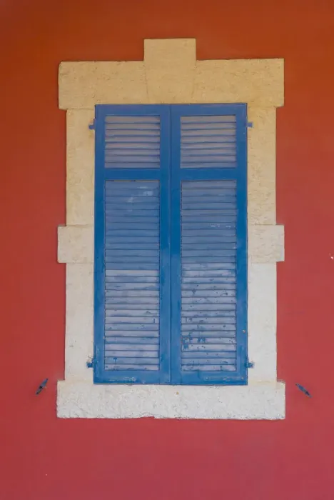 Framed Print : Blue wooden shutters and red wall in Larnaca, Cyprus Framed Print : Blue wooden shutters and red wall in Larnaca, Cyprus