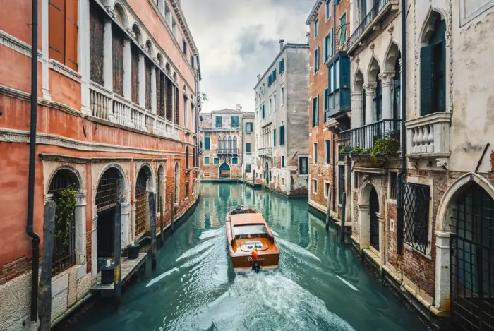 Framed Print : A boat cruising a green canal in Venice, Veneto, Italy Framed Print : A boat cruising a green canal in Venice, Veneto, Italy