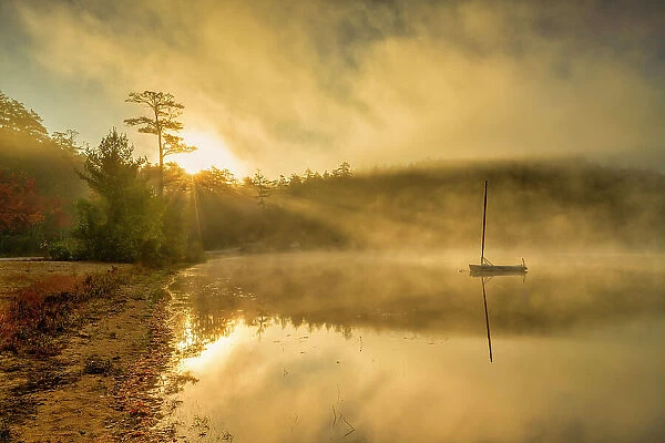 Boat on Crystal Lake at Sunrise, Eaton Center, New Hampshire, USA