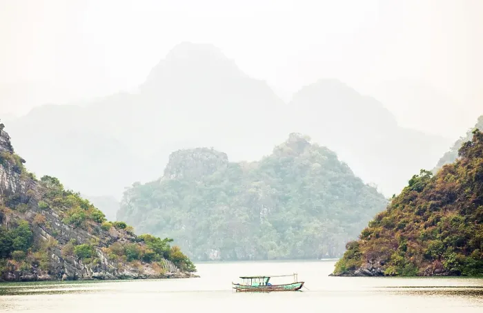Framed Print : Boat and limestone islands at dawn, Halong Bay, Northeast Vietnam Framed Print : Boat and limestone islands at dawn, Halong Bay, Northeast Vietnam