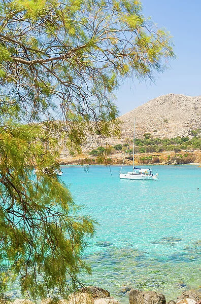 A boat at Pondamos Beach, Halki, Chalki, Dodecanese Islands, Greece
