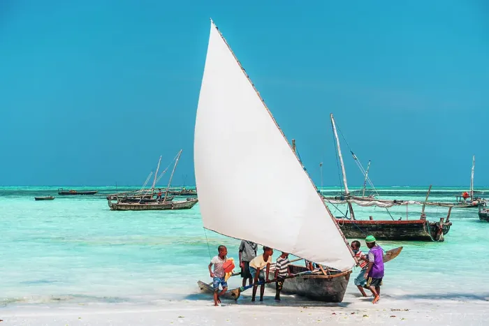 Framed Print : Boat on the shore at low tide, Nungwi, Zanzibar, Tanzania, Africa