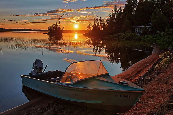 Boat and sunset on Lac des Sables Belleterre, Quebec, Canada