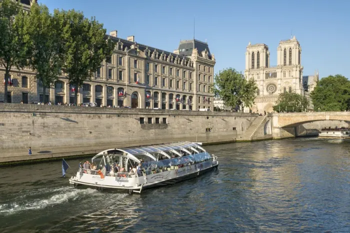 Framed Print : Boat tour along the banks of the Seine with cathedral Notre Dame in the background Framed Print : Boat tour along the banks of the Seine with cathedral Notre Dame in the background