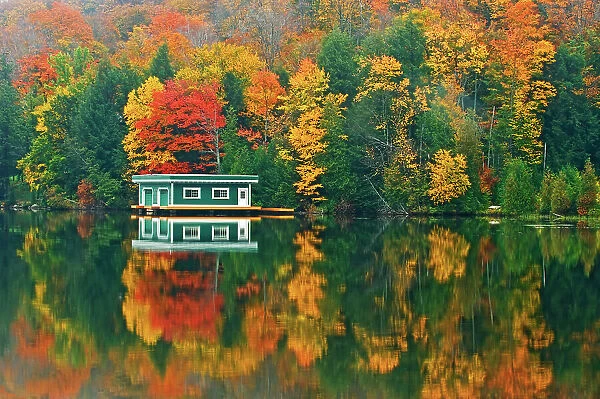 Boathouse and reflection in atumn Rosseau, Ontario, Canada