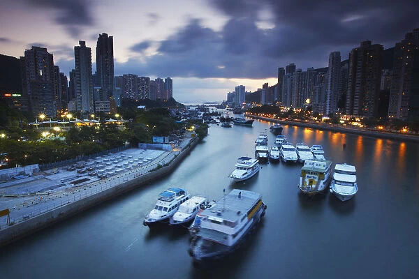 Boats in Aberdeen Harbour at dusk, Aberdeen, Hong Kong, China