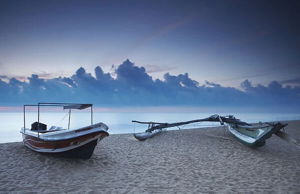 Boats on beach at sunset, Negombo, North Western Province, Sri Lanka
