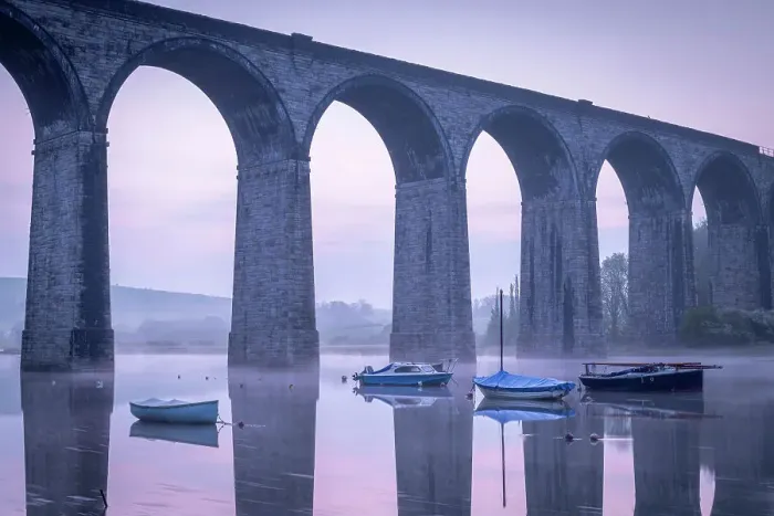 Framed Print : Boats beneath St Germans Victorian viaduct at dawn, St Germans in Cornwall, England. Spring (April) 2022 Framed Print : Boats beneath St Germans Victorian viaduct at dawn, St Germans in Cornwall, England. Spring (April) 2022