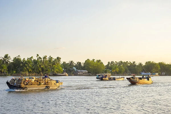 Boats on the Cần Thơ River, a branch of the Mekong River at sunset, Cần Thơ, Vietnam
