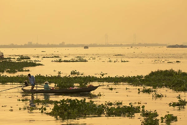 Boats on canal and My Thuan bridge, Vinh Long, Mekong Delta, Vietnam