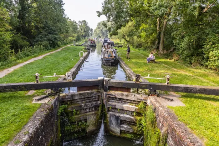 Framed Print : Boats going through a lock in Great Bedwyn, Marlborough, Wiltshire, England, United Kingdom Framed Print : Boats going through a lock in Great Bedwyn, Marlborough, Wiltshire, England, United Kingdom