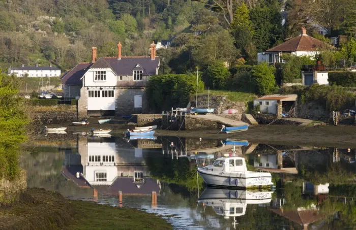 Framed Print : Boats and houses beside the River Yealm in the picturesque South Hams village of Newton Framed Print : Boats and houses beside the River Yealm in the picturesque South Hams village of Newton