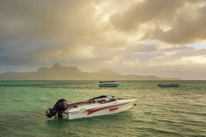 Framed Print : Boats on a lagoon near Point Jerome at sunrise, Preskil Island, Mahebourg, Mauritius, East Africa. Summer (June) 2024