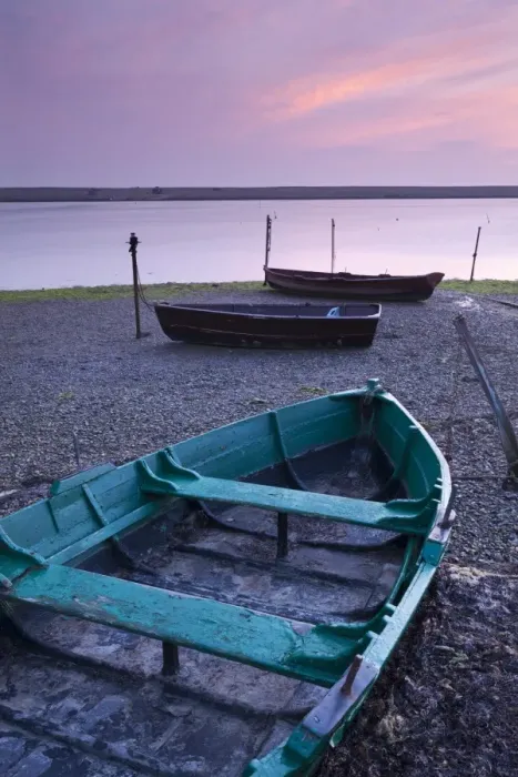 Framed Print : Boats at low tide on the shore of The Fleet lagoon, Chesil Beach, Dorset, England. Spring Framed Print : Boats at low tide on the shore of The Fleet lagoon, Chesil Beach, Dorset, England. Spring