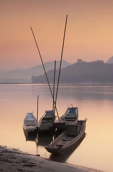 Boats on Mekong River at sunset, Luang Prabang, Laos