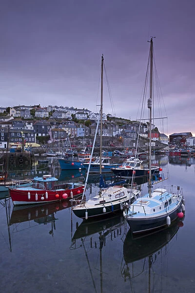 Boats moored in Mevagissey harbour at dawn, Cornwall, England. Spring
