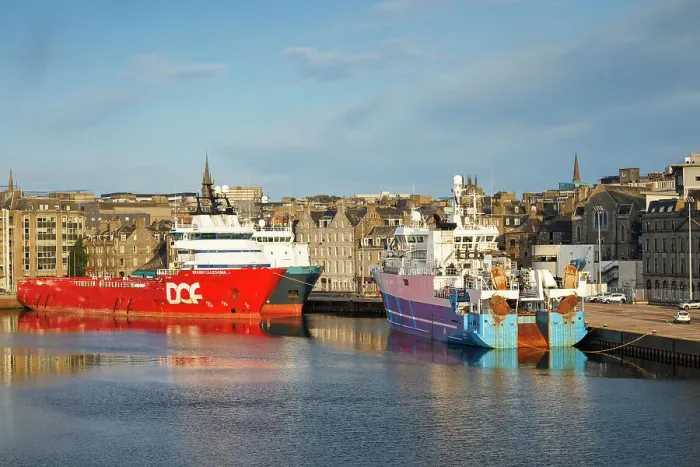 Framed Print : Boats at sea port with the City of Aberdeen, Aberdeen, Scotland, UK