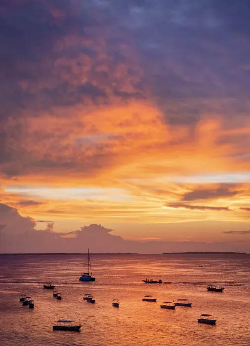 Framed Print : Boats on the sea in silhouette at sunset, Nungwi, Zanzibar, Tanzania Framed Print : Boats on the sea in silhouette at sunset, Nungwi, Zanzibar, Tanzania