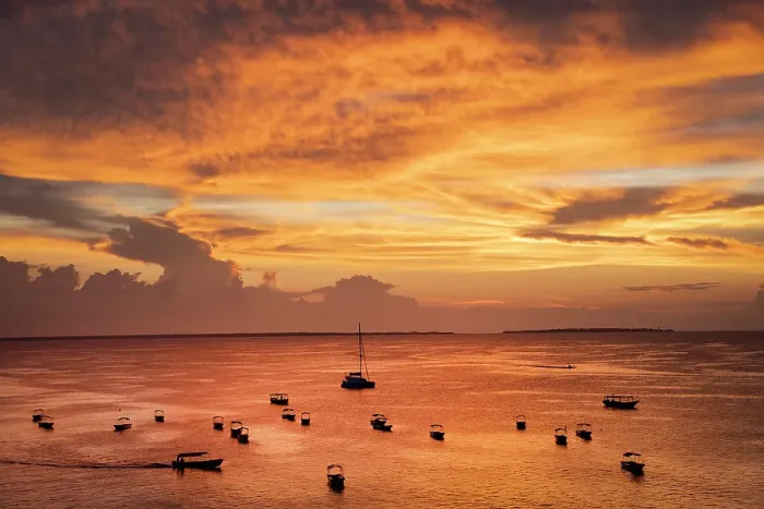 Framed Print : Boats on the sea in silhouette at sunset, Nungwi, Zanzibar, Tanzania Framed Print : Boats on the sea in silhouette at sunset, Nungwi, Zanzibar, Tanzania