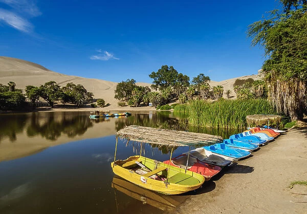 Boats on the shore of the Huacachina Lake, Ica Region, Peru