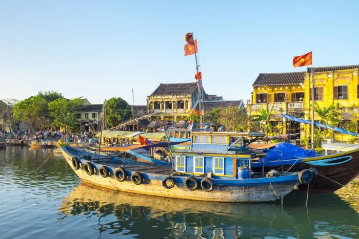 Framed Print : Boats on the Thu Ban'n River in front of Hoi An Ancient Town in late afternoon, Hoi An