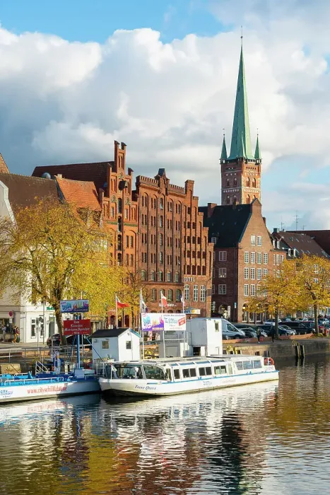 Framed Print : Boats on Trave river, traditional houses and St Petri Lubeck Church in background, Lubeck, UNESCO, Schleswig-Holstein, Germany Framed Print : Boats on Trave river, traditional houses and St Petri Lubeck Church in background, Lubeck, UNESCO, Schleswig-Holstein, Germany