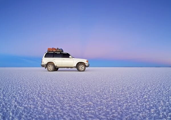 Bolivia, Potosi Department, Daniel Campos Province, White Toyota Landcruiser on the Salar de Uyuni