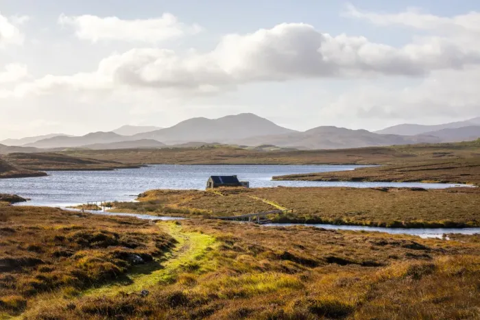 Framed Print : Bothy beside a loch and beautiful mountains beyond, Isle of Harris, Outer Hebrides Framed Print : Bothy beside a loch and beautiful mountains beyond, Isle of Harris, Outer Hebrides
