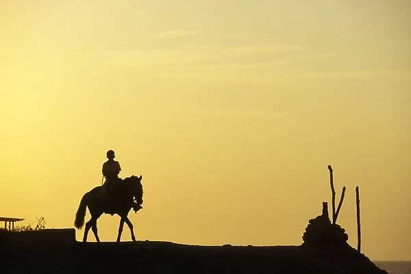 A boy on horseback at the beach village of Mancora