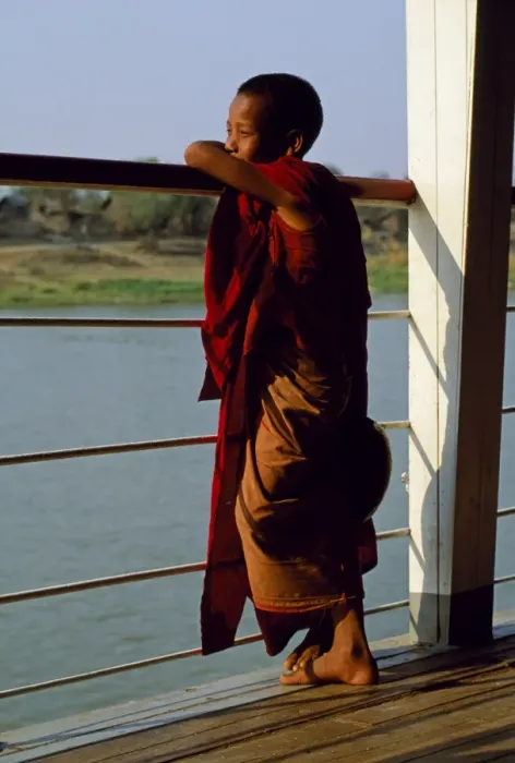 Framed Print : A boy monk gazing out over the rails of a boat on the Irrawaddy River Framed Print : A boy monk gazing out over the rails of a boat on the Irrawaddy River