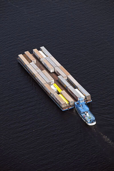 Brazil, Amazonas, container barge and tug on the Rio Negro in Manaus in the Brazilian