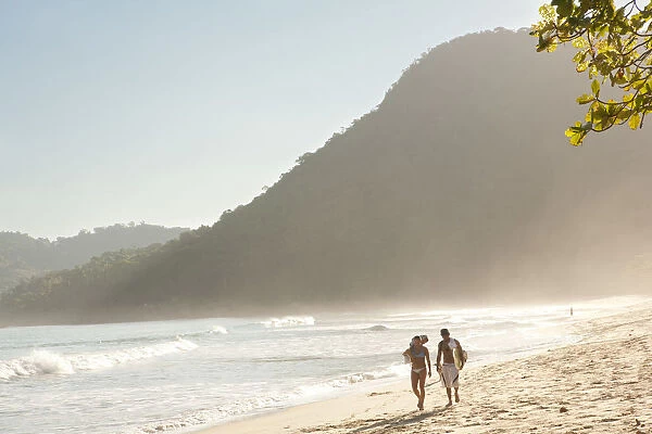 Brazil, Rio de Janeiro State, Costa Verde (Green coast), Paraty, a couple with a surf