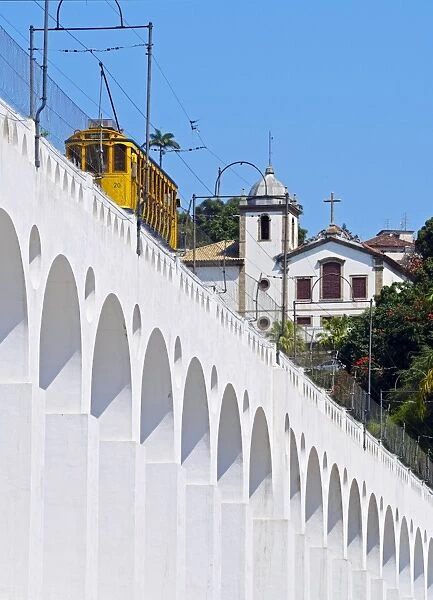 Brazil, State of Rio de Janeiro, City of Rio de Janeiro, Lapa, Tram crossing the Carioca Aqueduct