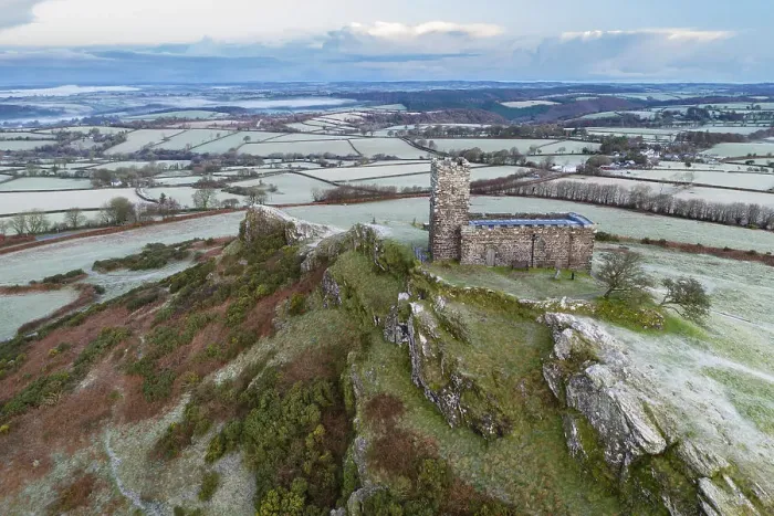 Framed Print : Brentor Church on a cold, frosty morning in Dartmoor National Park, Devon, England. Winter (December) 2022