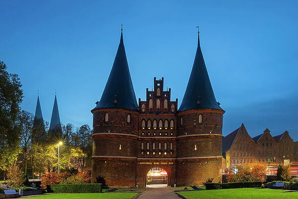 Brick-built Medieval gate to Lubeck named Holstentor at twilight, Lubeck, UNESCO, Schleswig-Holstein, Germany