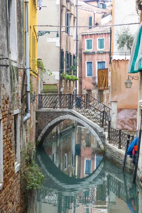 Framed Print : A bridge crosses a small canal, Castello, Venice; veneto; Italy Framed Print : A bridge crosses a small canal, Castello, Venice; veneto; Italy
