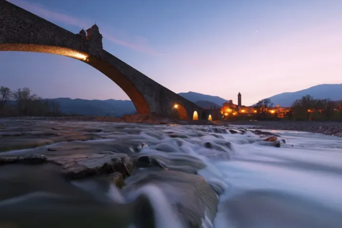 Framed Print : The bridge Gobbo of Bobbio at dusk, Piacenza district, Italy Framed Print : The bridge Gobbo of Bobbio at dusk, Piacenza district, Italy