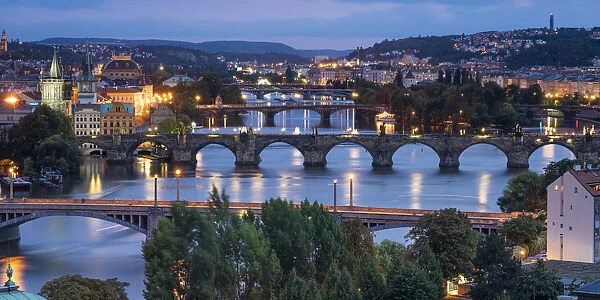 Bridges over Vltava river against sky seen from Letna park at night, Prague, Bohemia