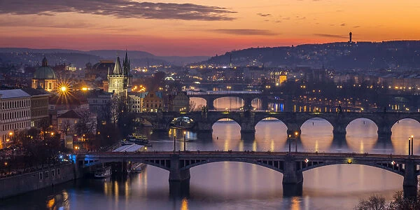 Bridges over Vltava river against sky seen from Letna park at sunset, Prague, Bohemia