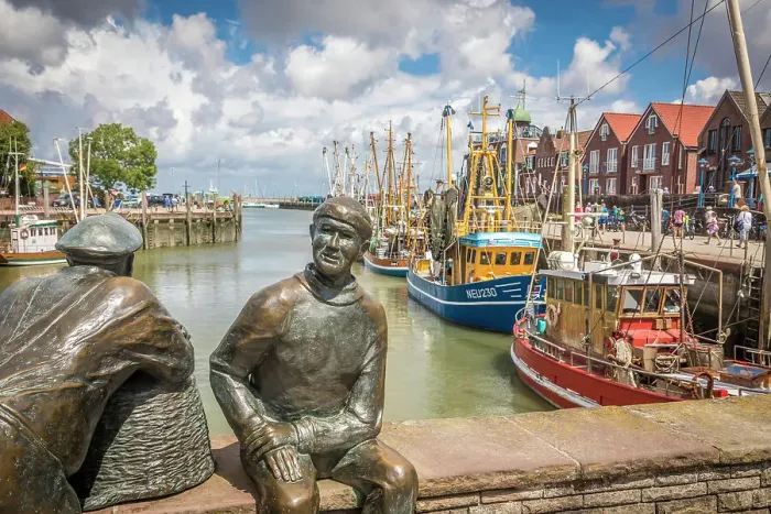 Framed Print : Bronze statues of fishermen in the harbor of Neuharlingersiel, East Frisia, Lower Saxony, Germany Framed Print : Bronze statues of fishermen in the harbor of Neuharlingersiel, East Frisia, Lower Saxony, Germany