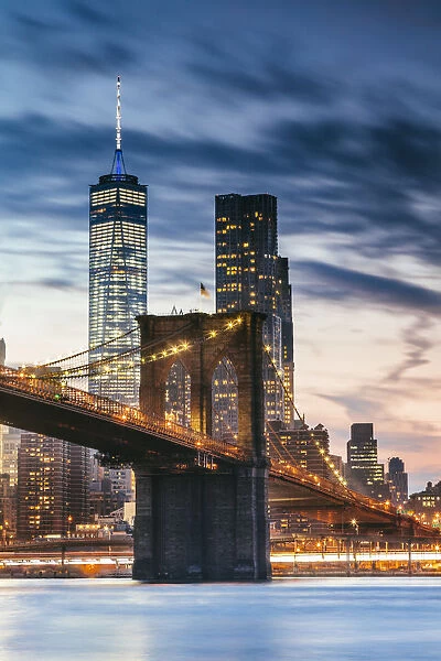 Brooklyn bridge and lower Manhattan skyline at dusk, New York city, USA