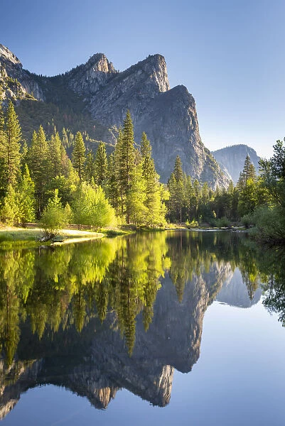 The Three Brothers mountains reflected in the River Merced in Yosemite Valley, Yosemite National Park, California, USA