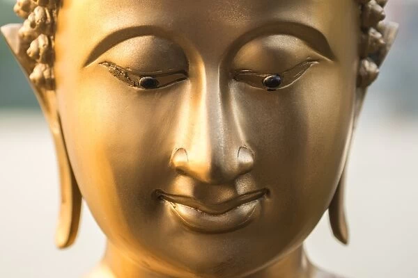 Buddha face, Seema Malaka temple on Beira Lake. Colombo, Sri Lanka