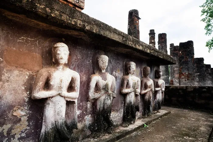 Framed Print : Buddha praying statues in a row in the old ruins of Wat Mahathat temple, Sukhothai Historical Park, Sukhothai, Thailand Framed Print : Buddha praying statues in a row in the old ruins of Wat Mahathat temple, Sukhothai Historical Park, Sukhothai, Thailand